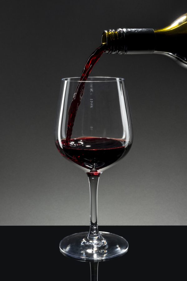 Red wine pouring into a wine glass
